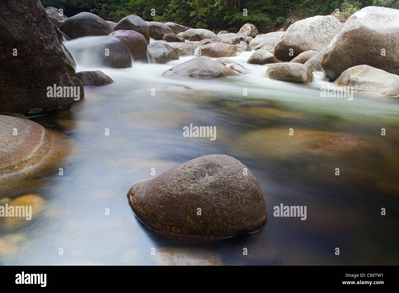 pebbels or rocks in creek or stream flowing water Stock Photo