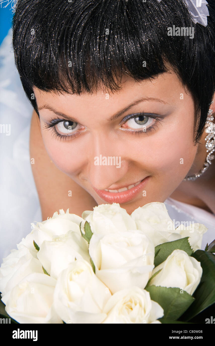 One happy and Beautiful bride on blue background Stock Photo - Alamy