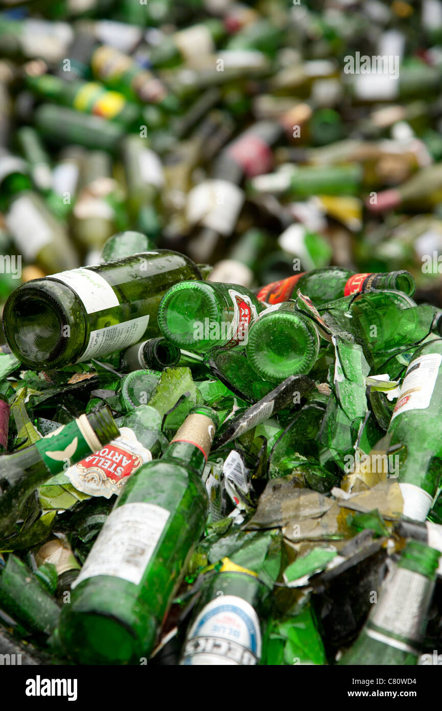 Piles of green glass beer and wine bottles at a recycling yard UK Stock Photo Alamy