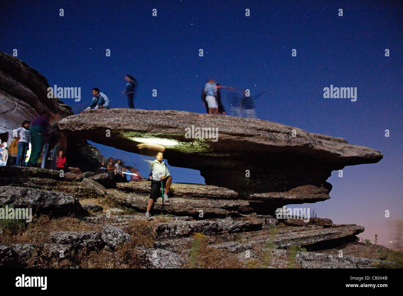 Hikers in a moonlit night Natural Park El Torcal Antequera Malaga Andalusia Spain Stock Photo