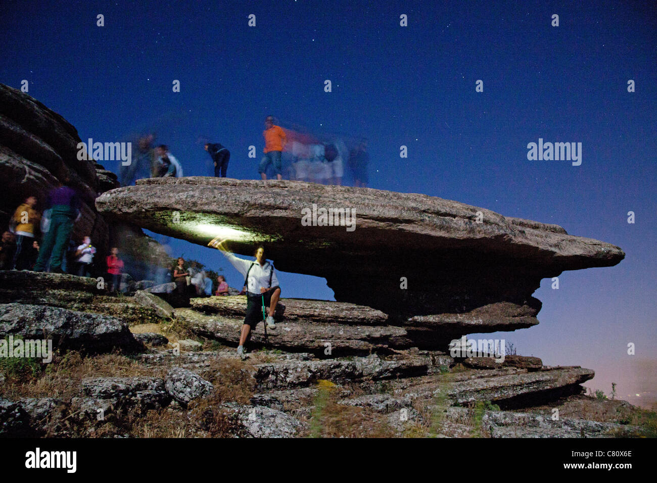 Hikers in a moonlit night Natural Park El Torcal Antequera Malaga Andalusia Spain Stock Photo