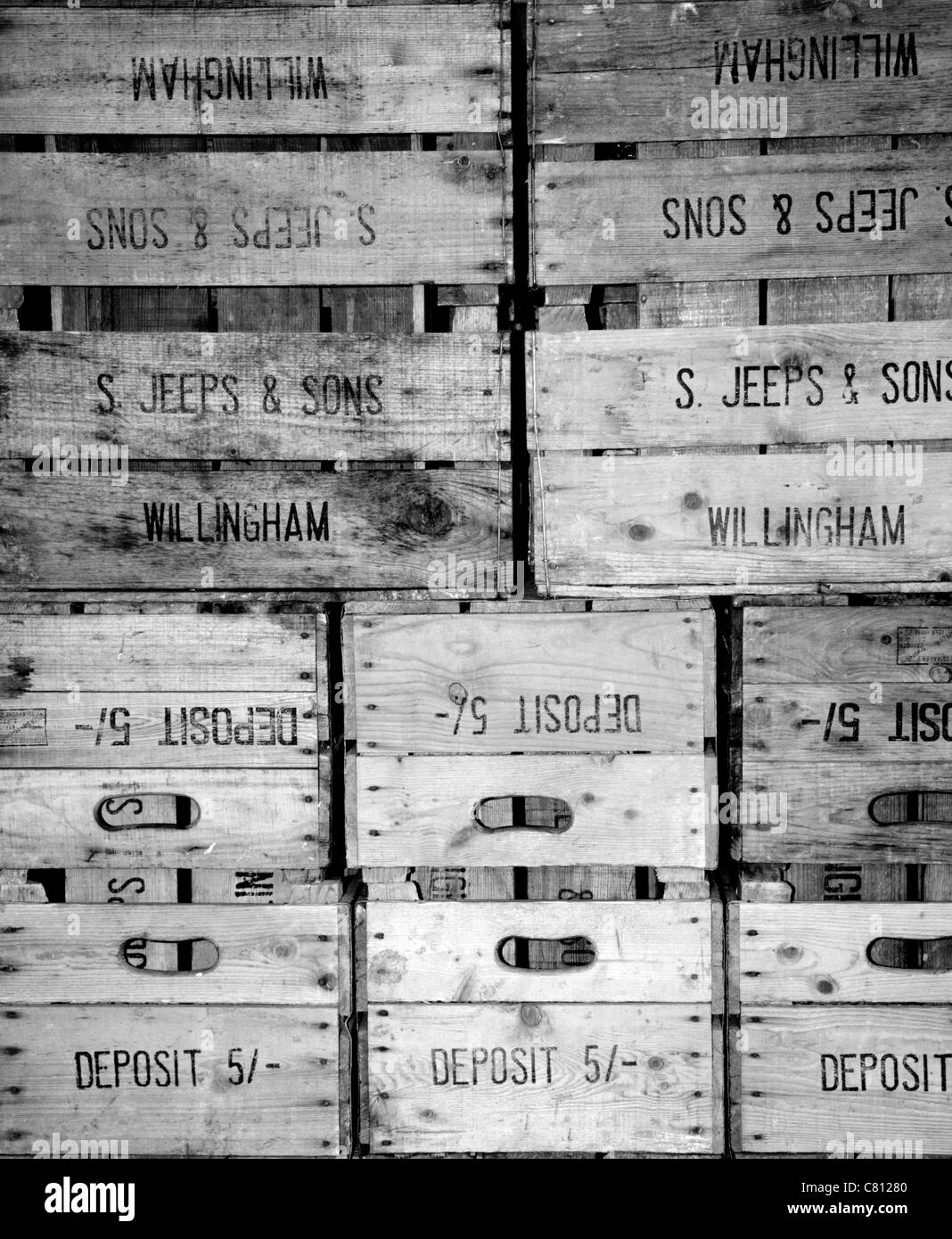 Bushel boxes. Fruit storage boxes in an English orchard stacked up. Stock Photo