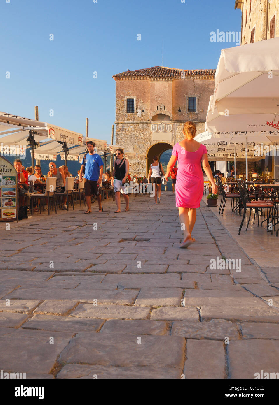 Tourists in Motovun old town in Istria, Croatia Stock Photo