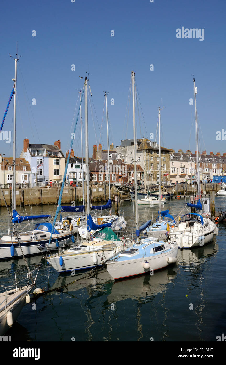 Weymouth Harbour Dorset England UK sailing boats with a backdrop of Custom House Quay Stock Photo