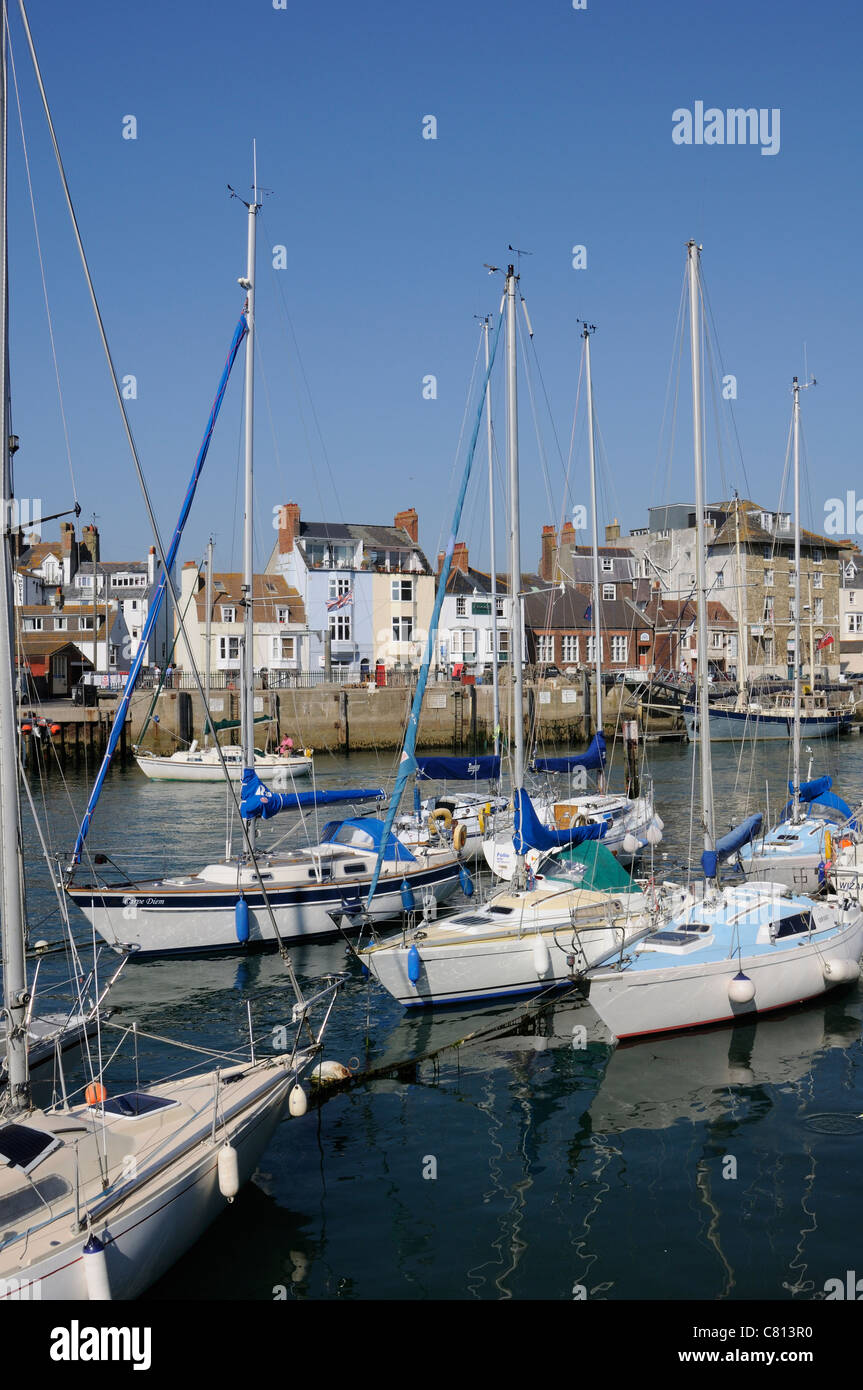Weymouth Harbour Dorset England UK sailing boats with a backdrop of Custom House Quay Stock Photo