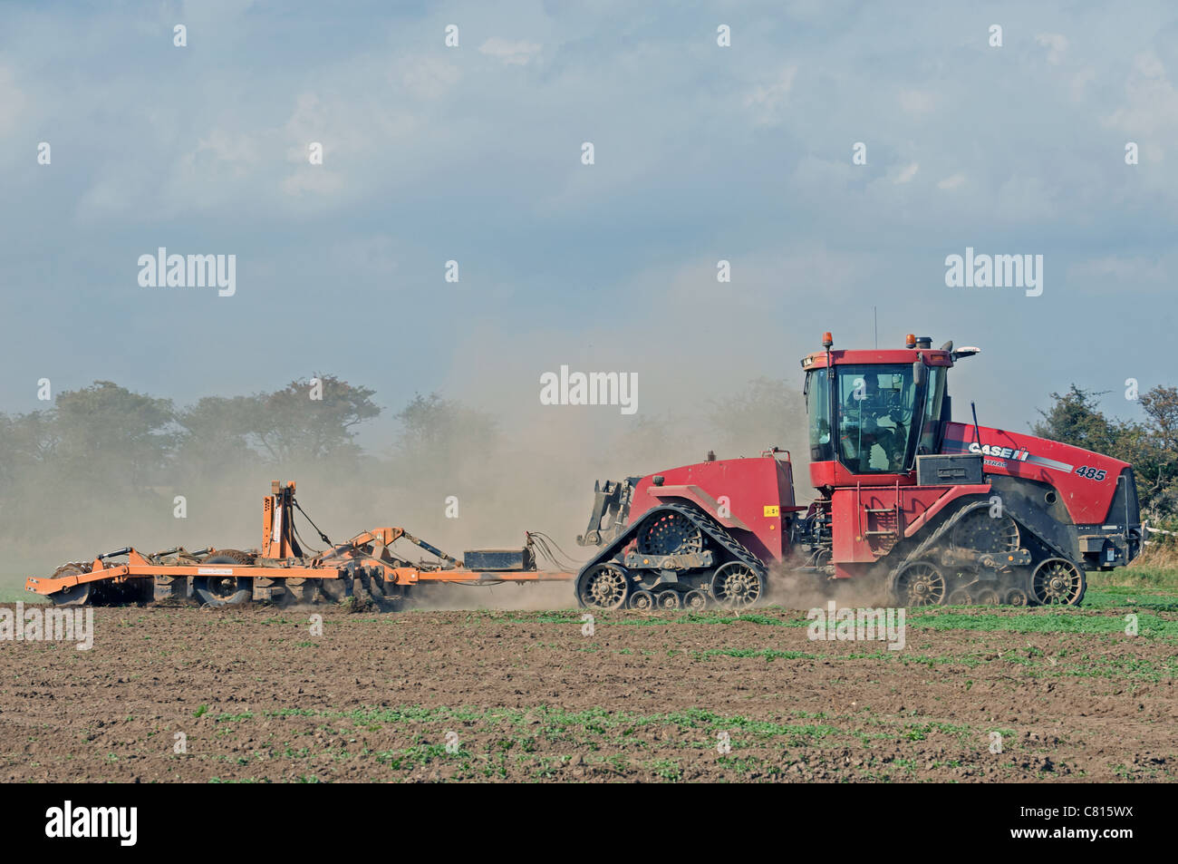 Case 485 Quadtrac fitted with harrows and discs to subsoil land Stock Photo