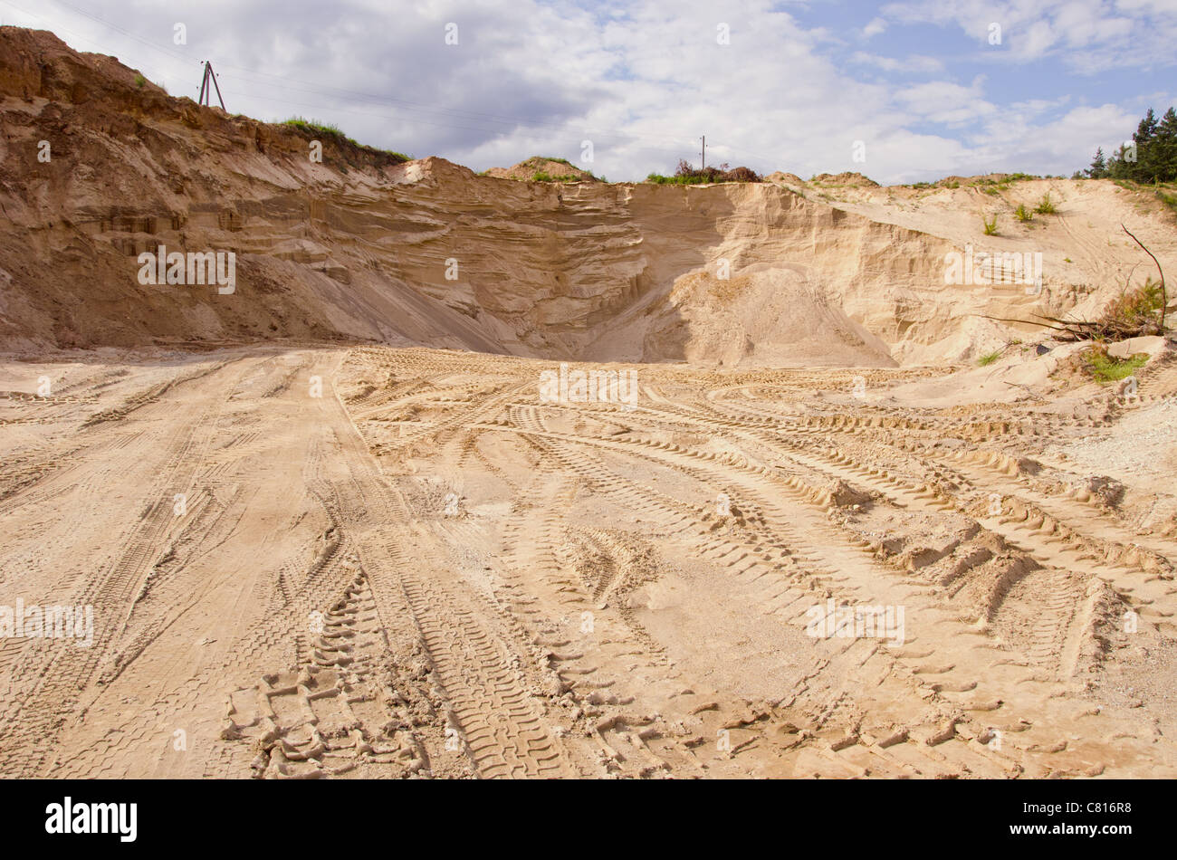 Sand pit. Sand special for construction. Pit full of fine sand and truck tracks. Stock Photo