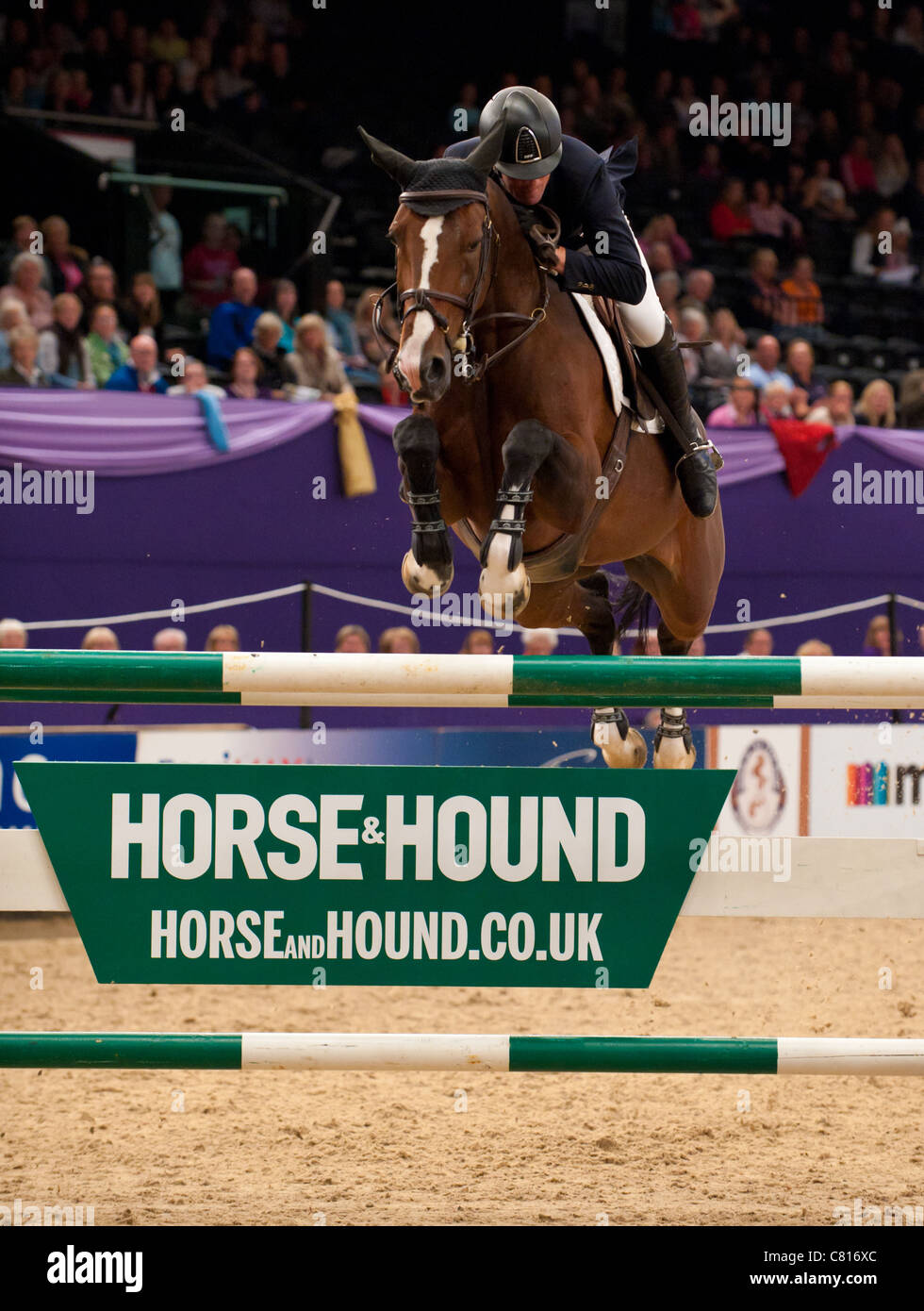 Guy Williams and Djakarta clear the last during the jump-off to win the Horse & Hound Foxhunter Championship 2011 Stock Photo