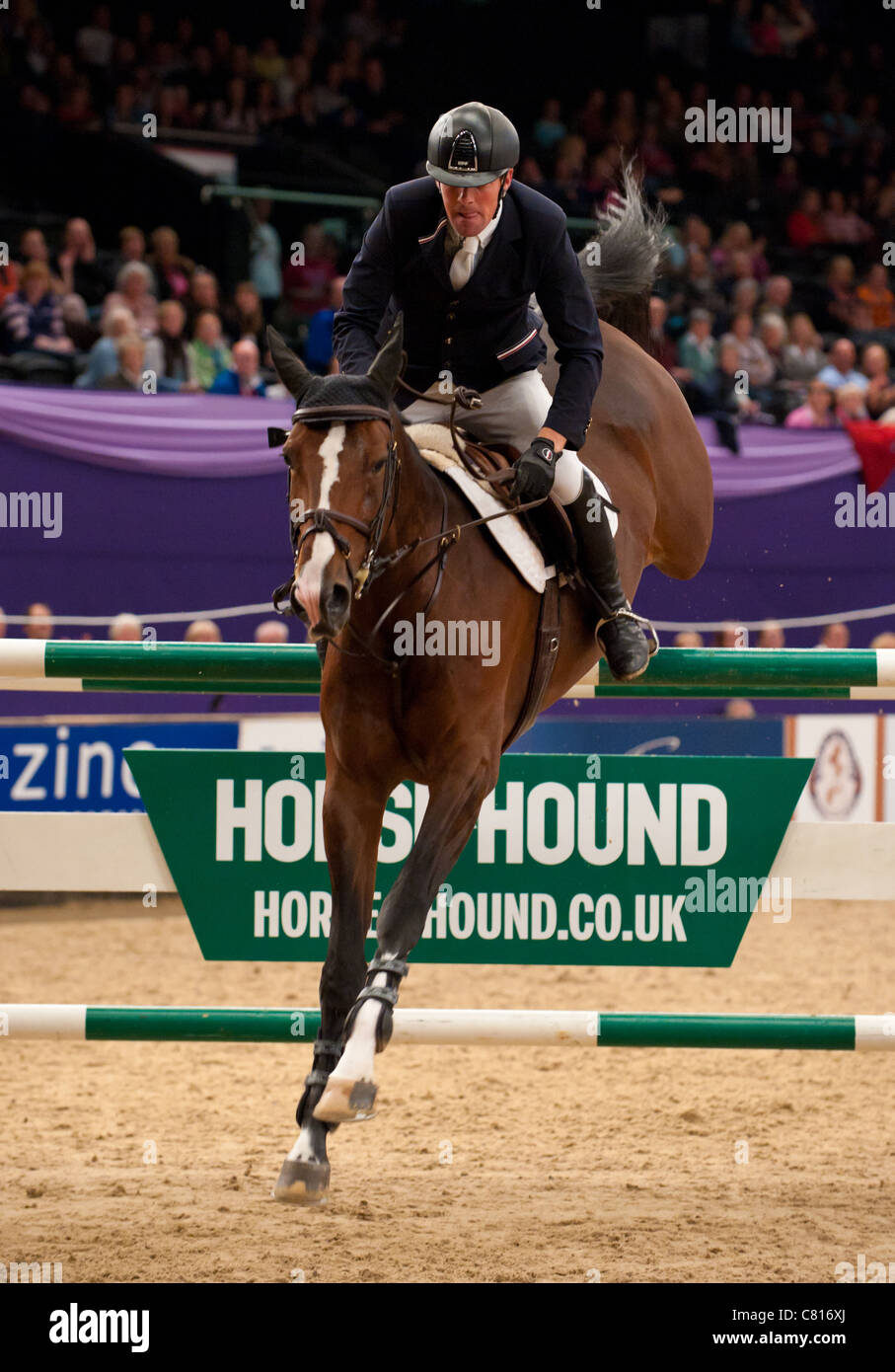 Guy Williams and Djakarta clear the last during the jump-off to win the Horse & Hound Foxhunter Championship 2011 Stock Photo