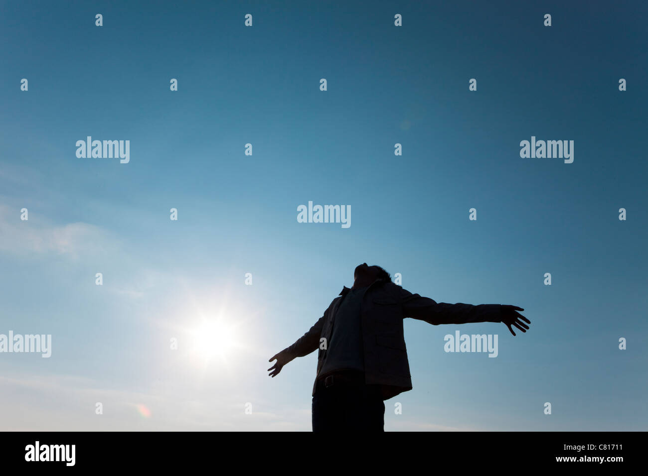 Mid Adult Man with Arms Outstretched Stock Photo - Alamy