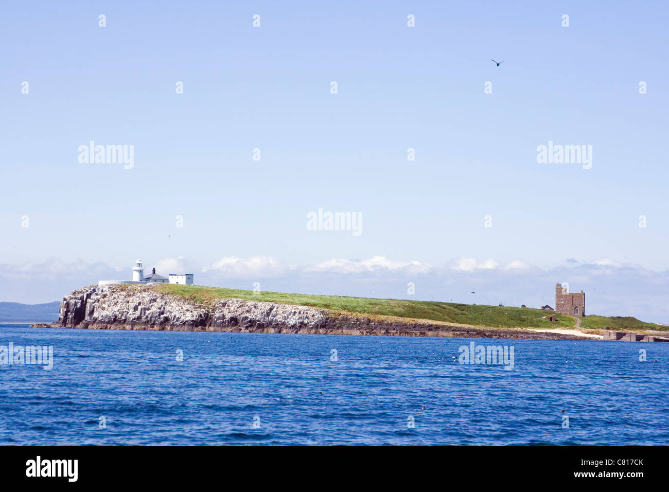 The Inner Farne Lighthouse and St. Cuthbert's Chapel on Inner Farne. Farne Islands, Northumberland Coast, England. Stock Photo