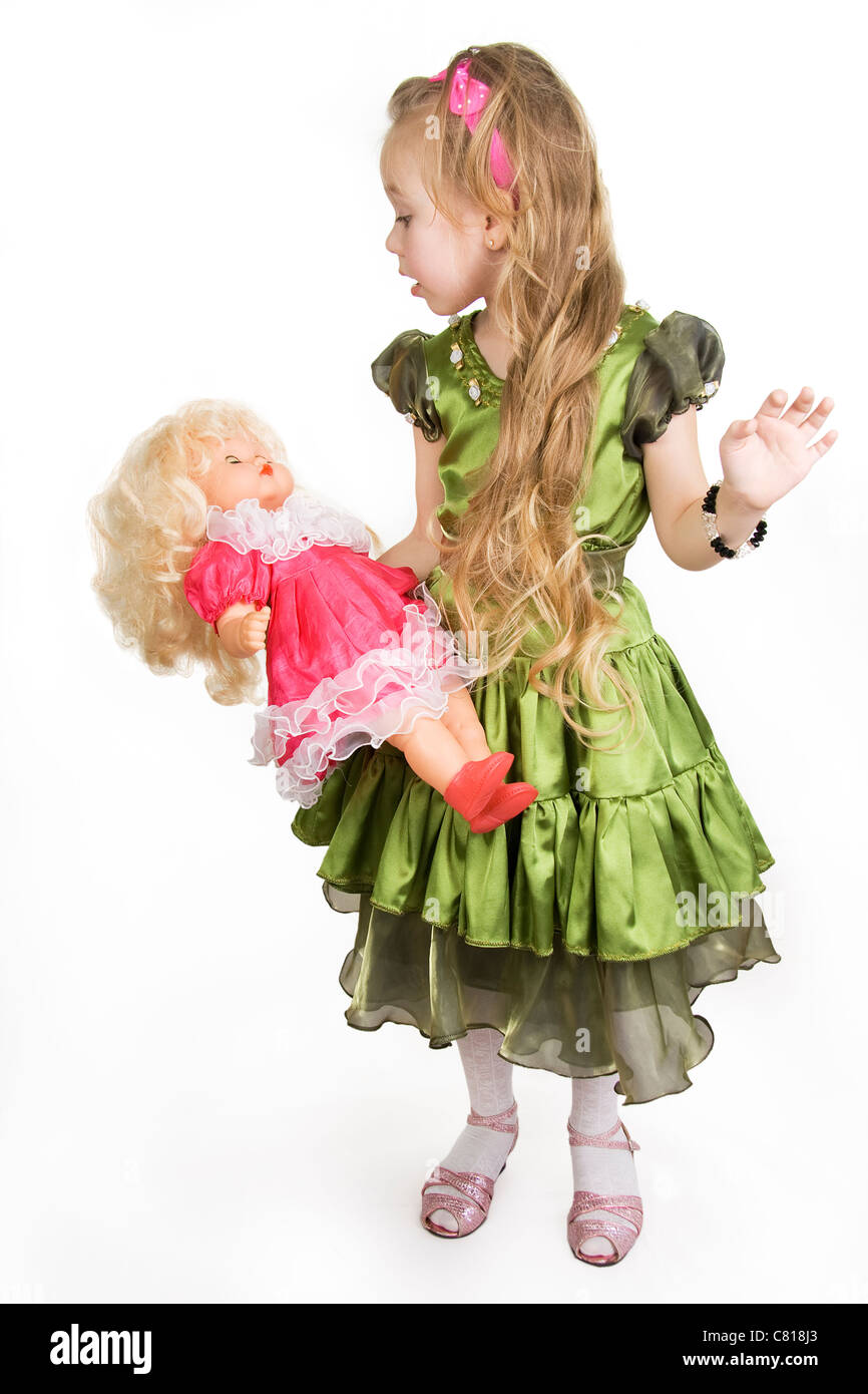 The little girl plays with a doll Stock Photo - Alamy