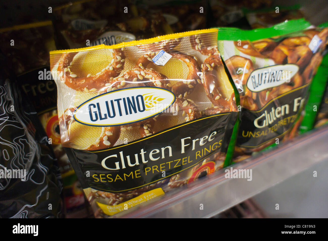 Packages of gluten-free pretzels are seen on a a supermarket shelf Stock Photo