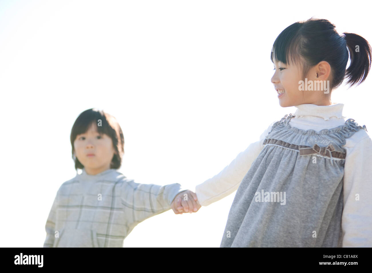 Girl and Boy Holding Hands Stock Photo - Alamy