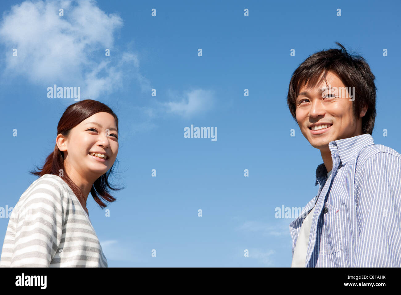 Young Couple and Blue Sky Stock Photo - Alamy