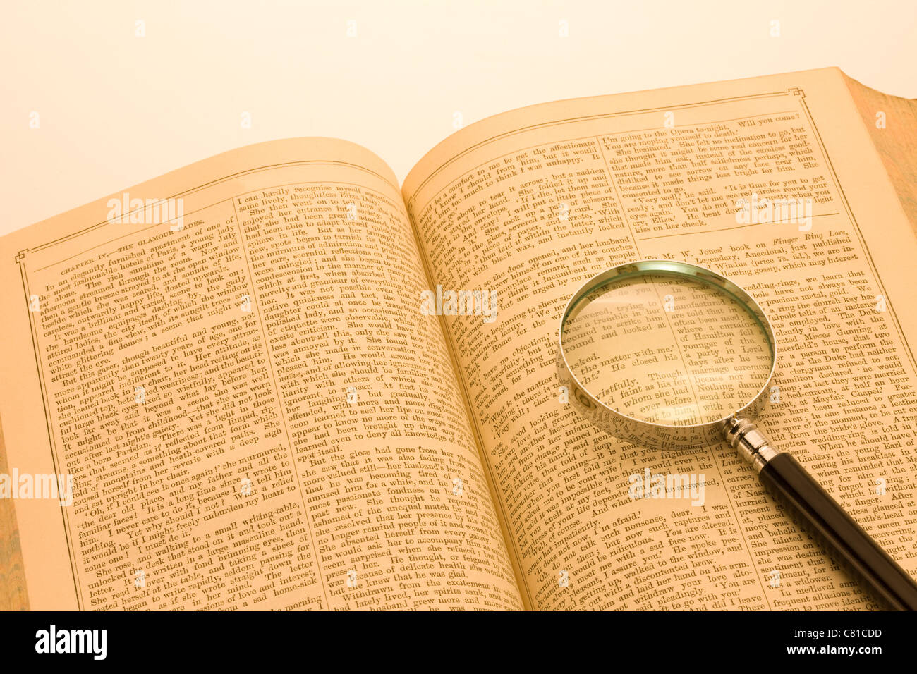 Magnifying Glass on Book Stock Photo