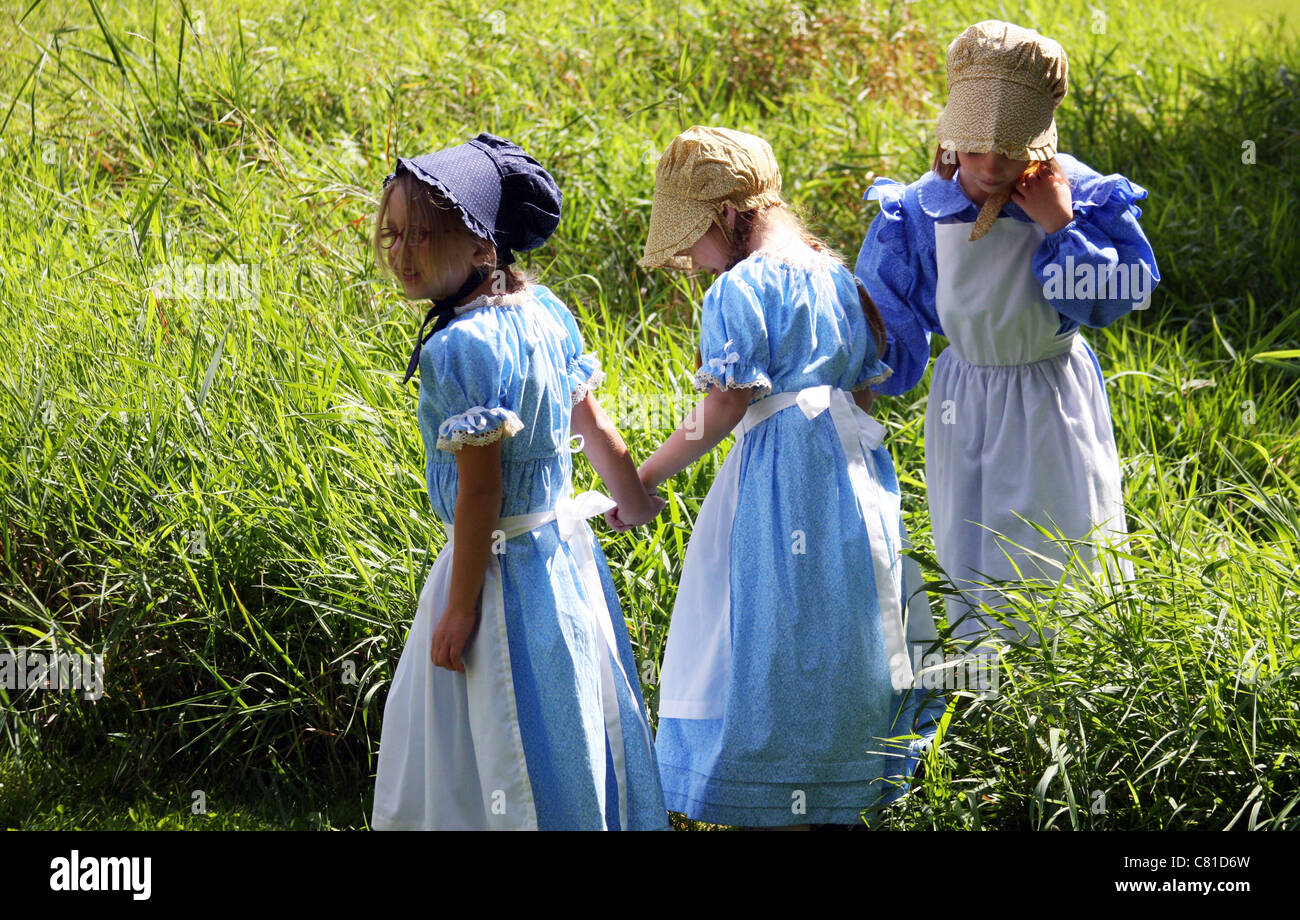 Three young girls holding hands Stock Photo - Alamy