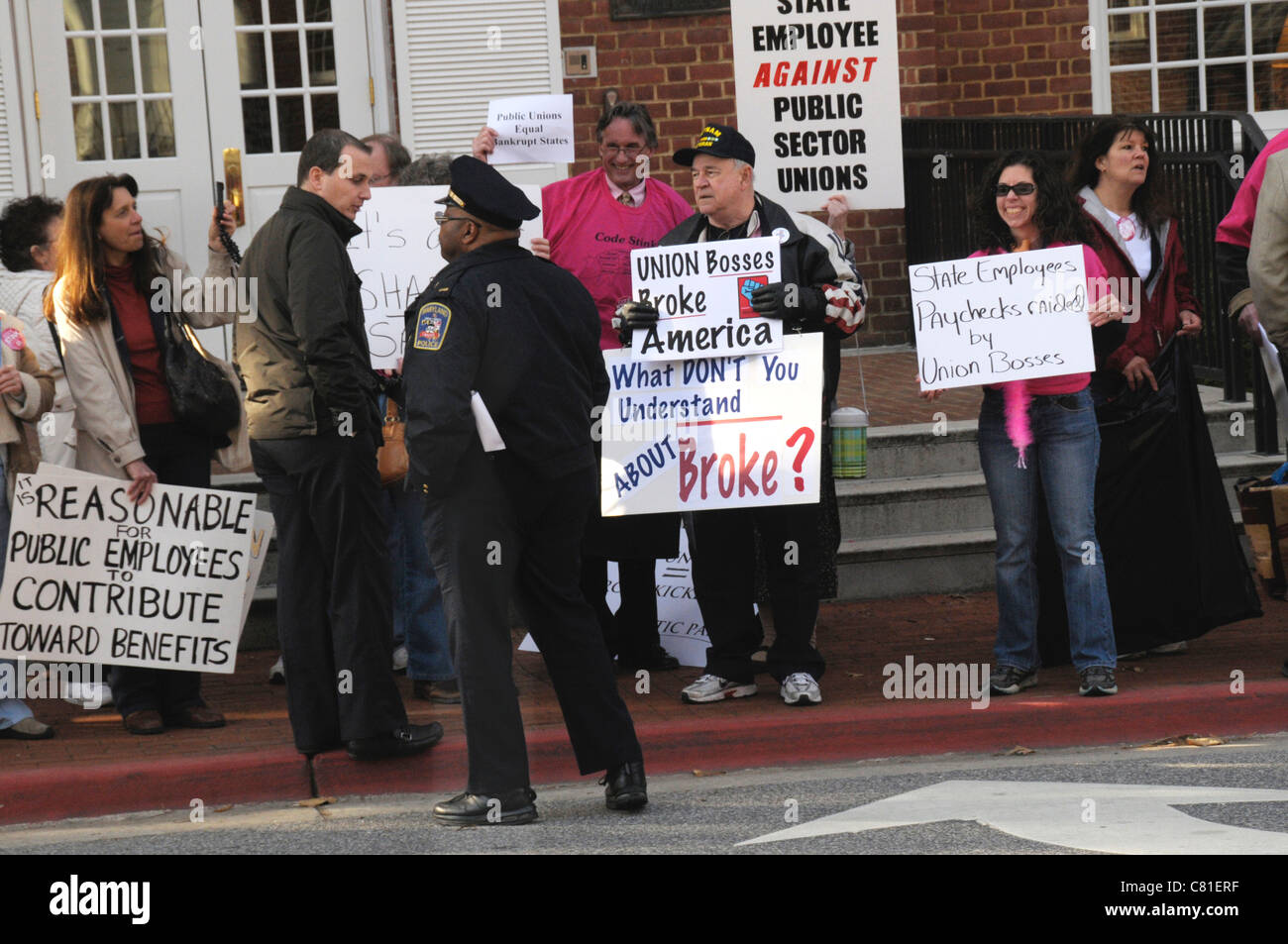 A policeman confronts one of the anti union demonstrator at their demonstration in Annapolis, Maryland Stock Photo