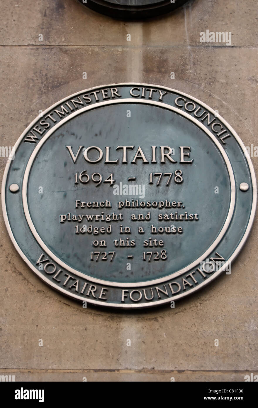 westminster council green plaque marking a lodging site of french philosopher and writer voltaire, maiden lane, london, england Stock Photo