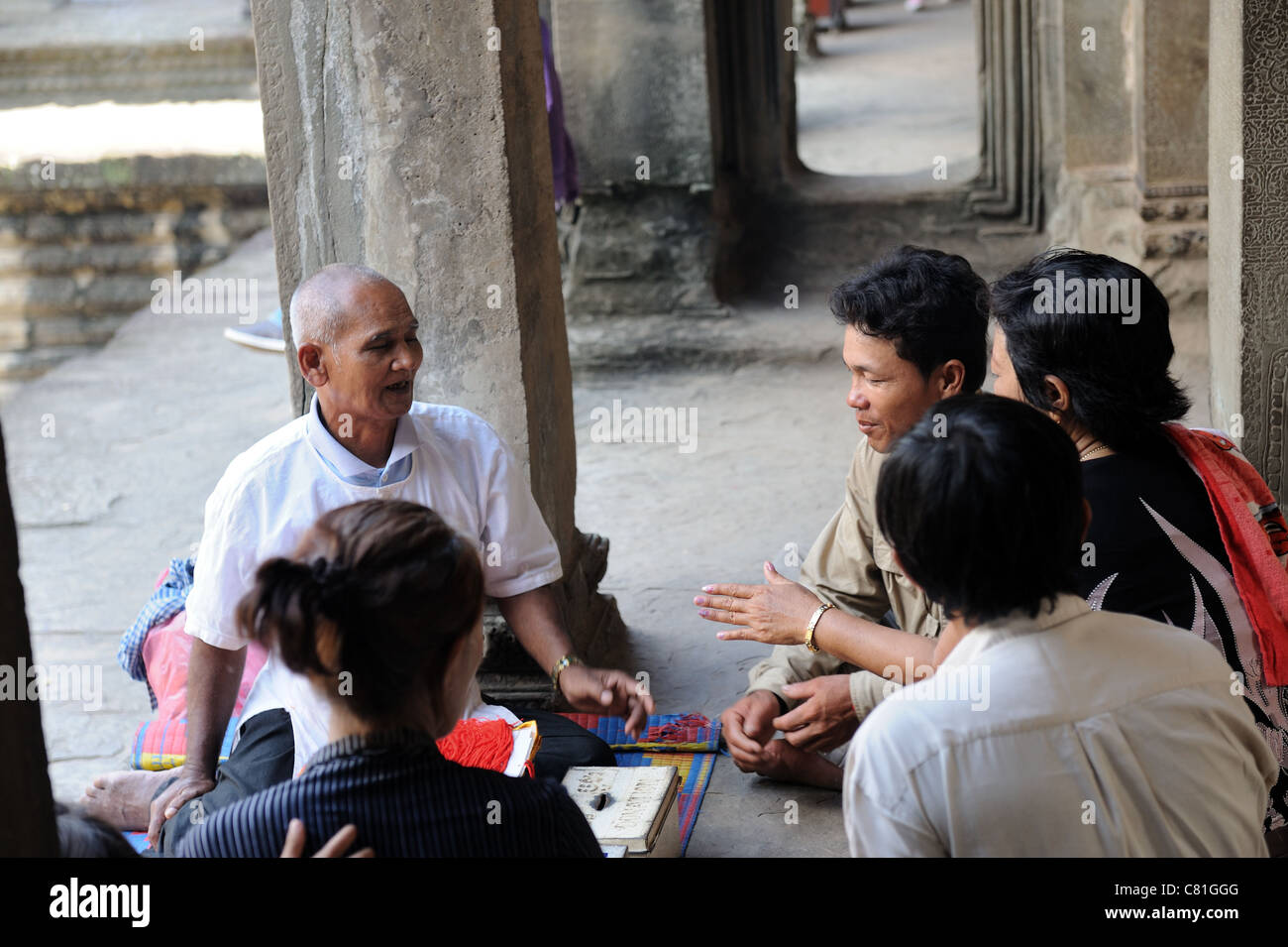 A group of local residents perform rituals on August 14, 2011 in Angkor wat temple, Siem Reap, Cambodia Stock Photo