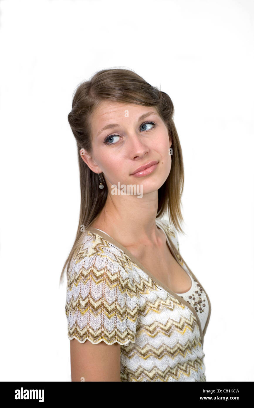 Studio image of girl against a plain background making facial expression. Stock Photo