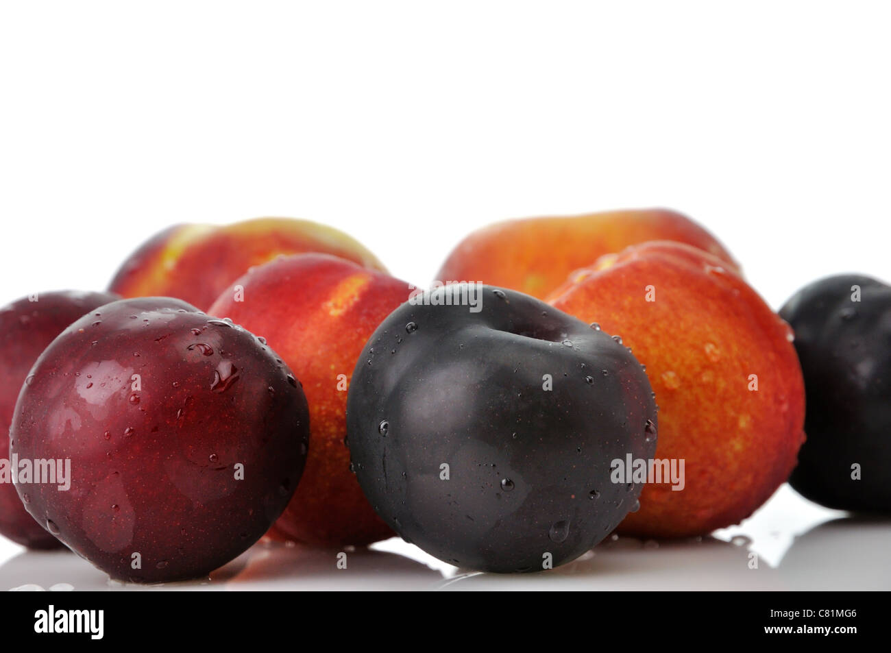 Juicy nectarines, plums and peaches on white background Stock Photo Alamy