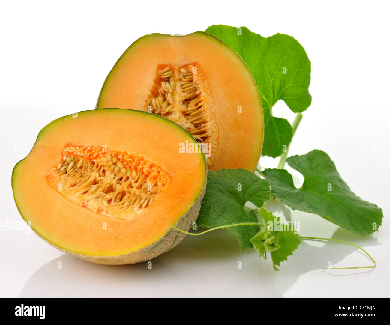 A fresh melon with leaves on white background Stock Photo Alamy
