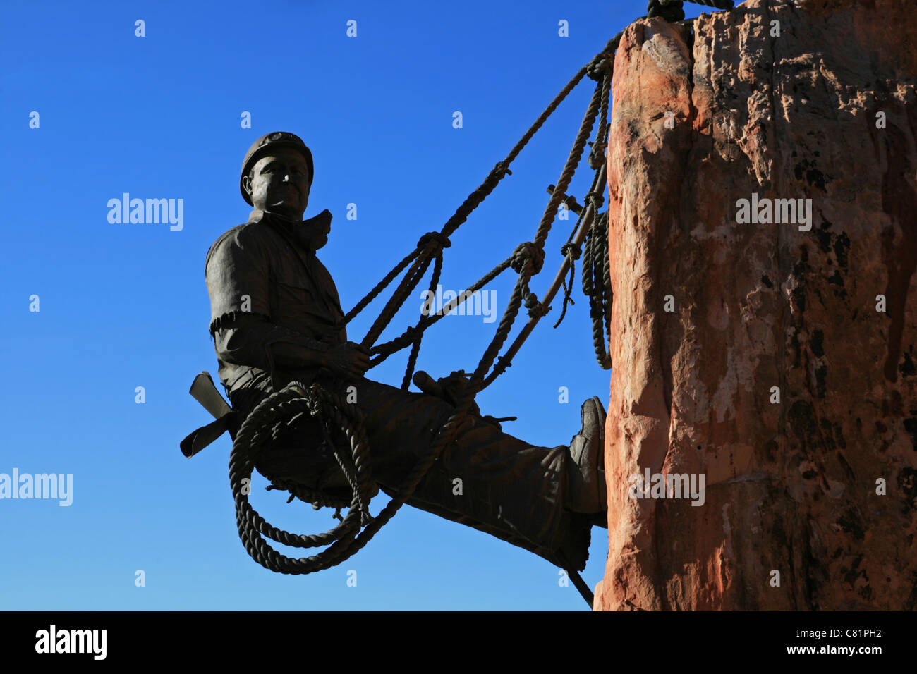statue of dam worker hanging on cliff at Hoover Dam, Nevada Stock Photo