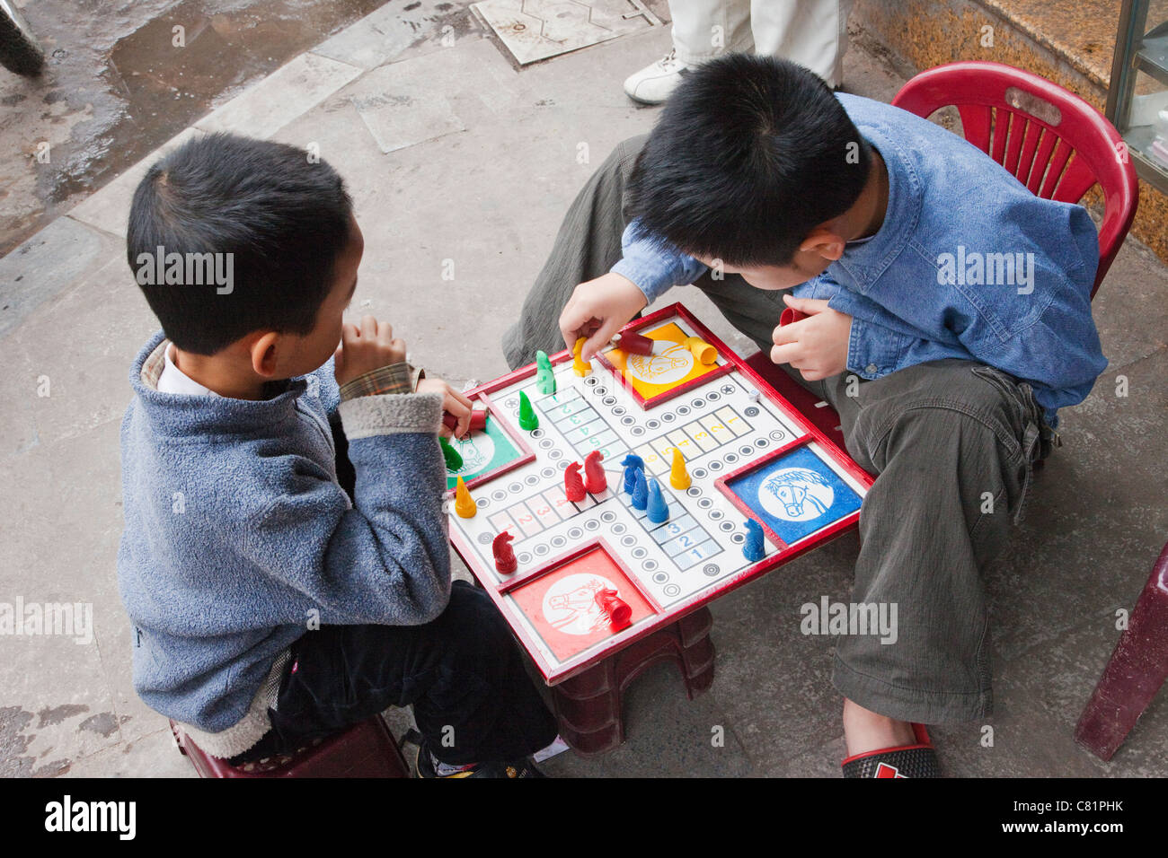 Vietnam, Hanoi, Young Boys Playing Board Game on Sidewalk Stock Photo Alamy