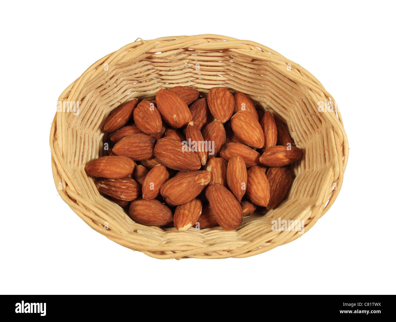 small wicker basket of shelled almond nuts isolated on white Stock Photo