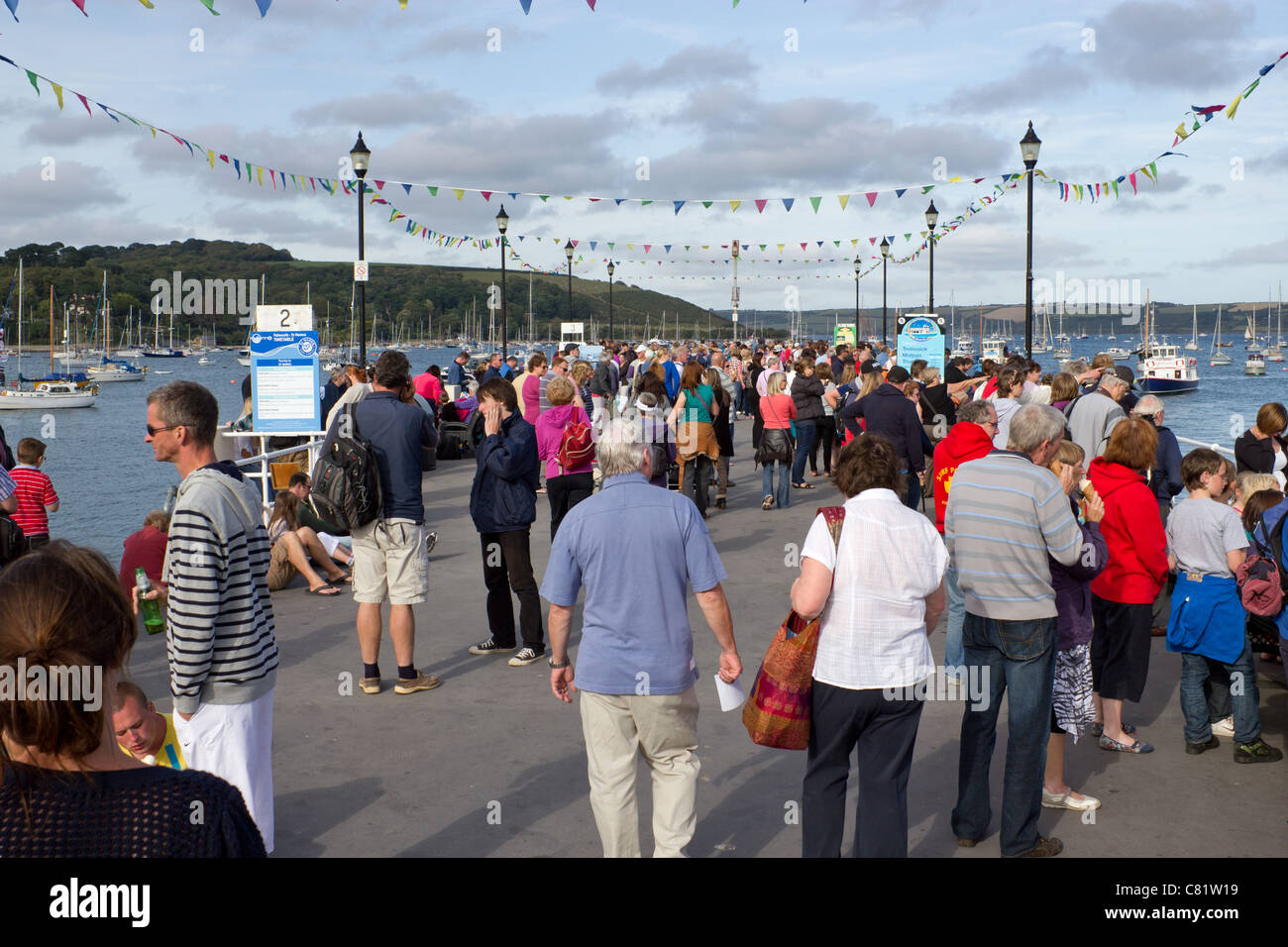 Lots of people gathering on Prince Of Wales Pier in Falmouth to watch the Red Arrows aerobatic display.. Stock Photo