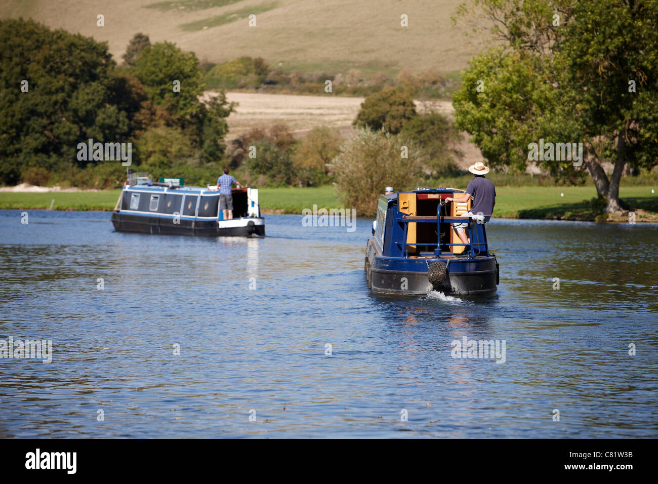 Two barges on the River Thames near to Maple Durham Lock, Berkshire. Stock Photo