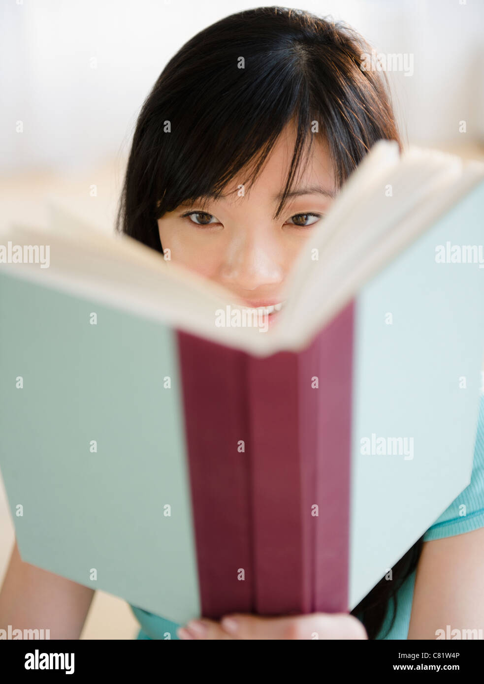 Korean woman reading book Stock Photo