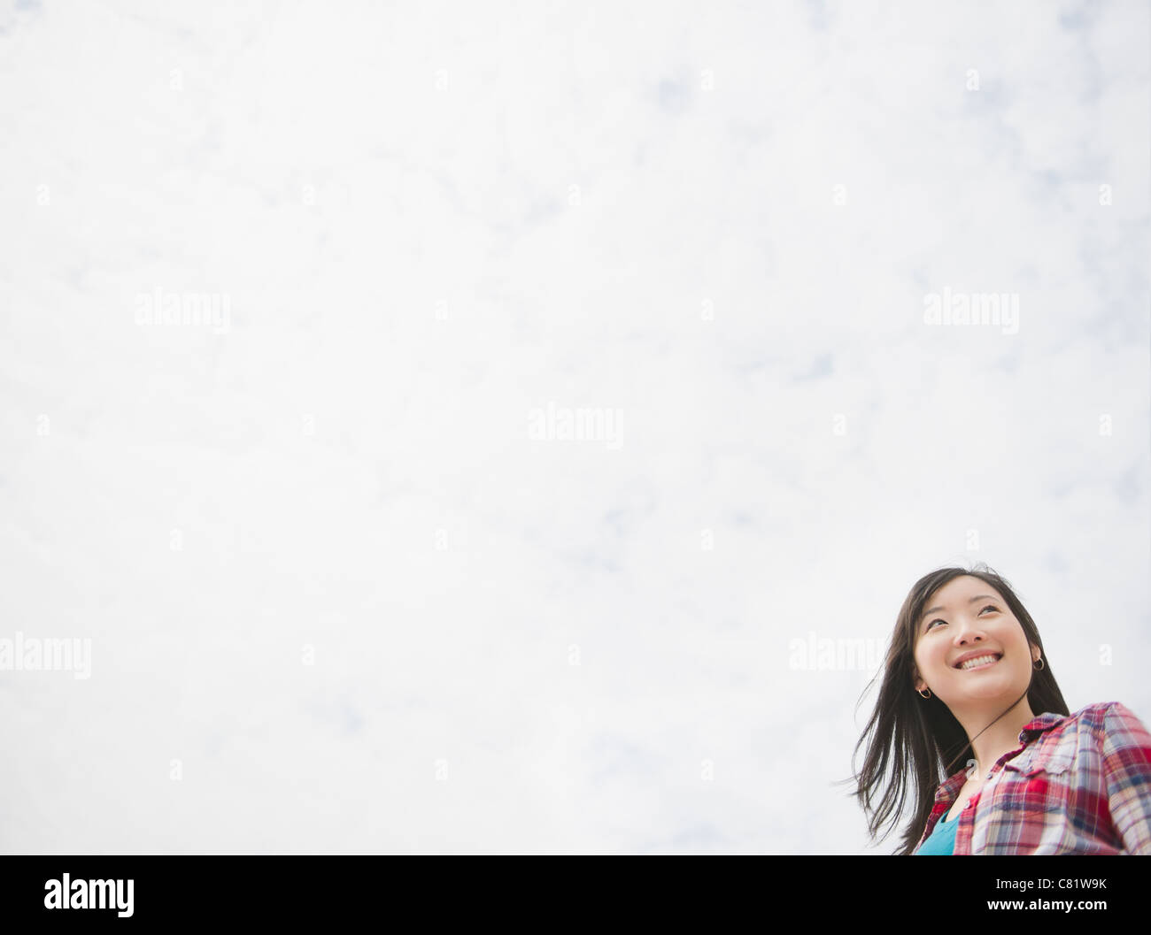 Smiling Korean woman outdoors Stock Photo