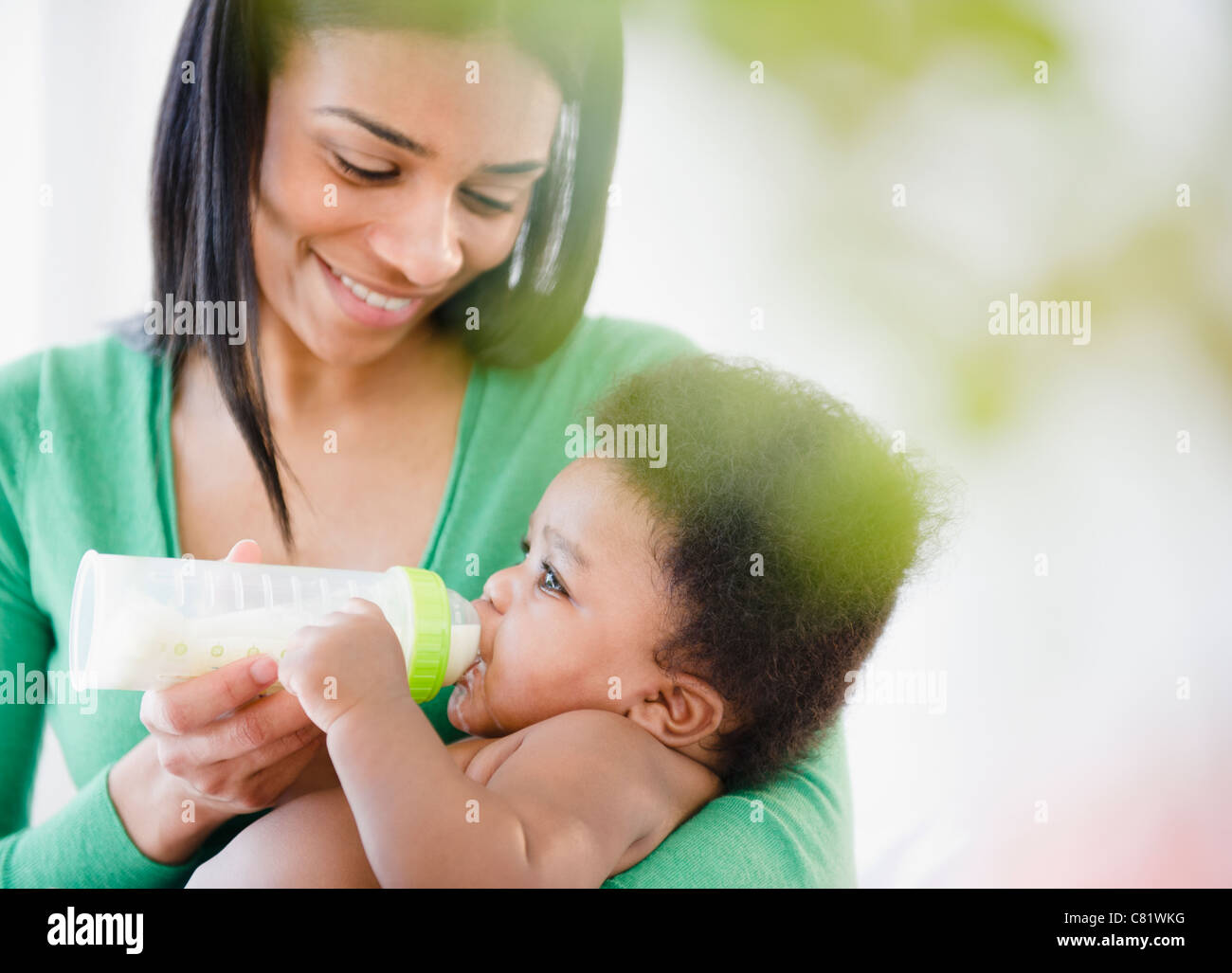 mother feeding bottle