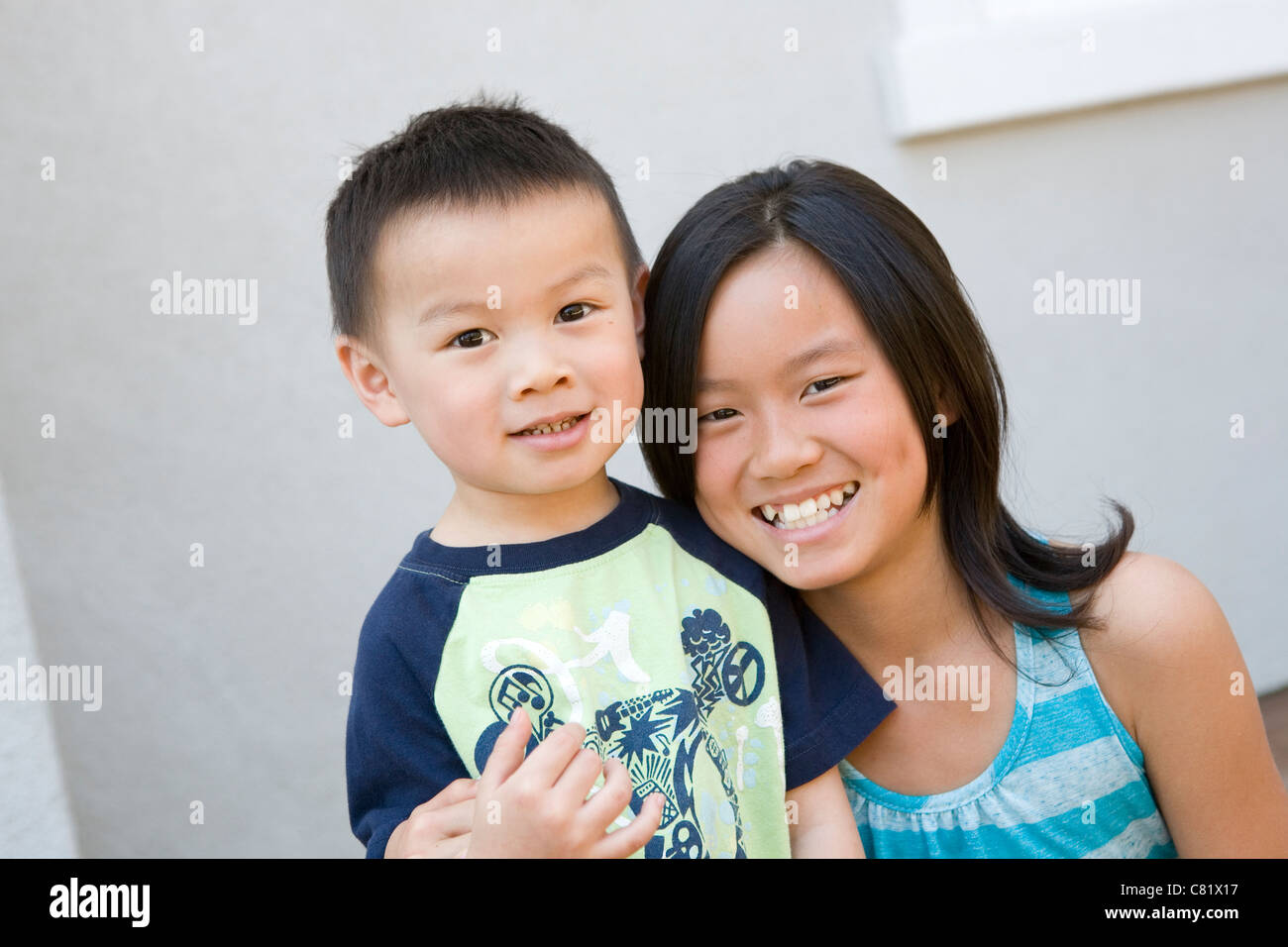 Chinese brother and sister hugging Stock Photo Alamy