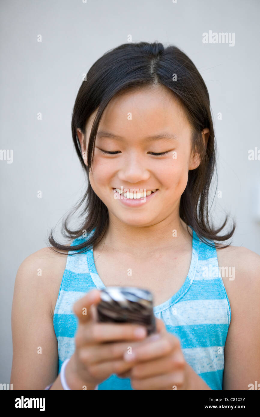 Asian girl answering phone hi-res stock photography and images - Alamy