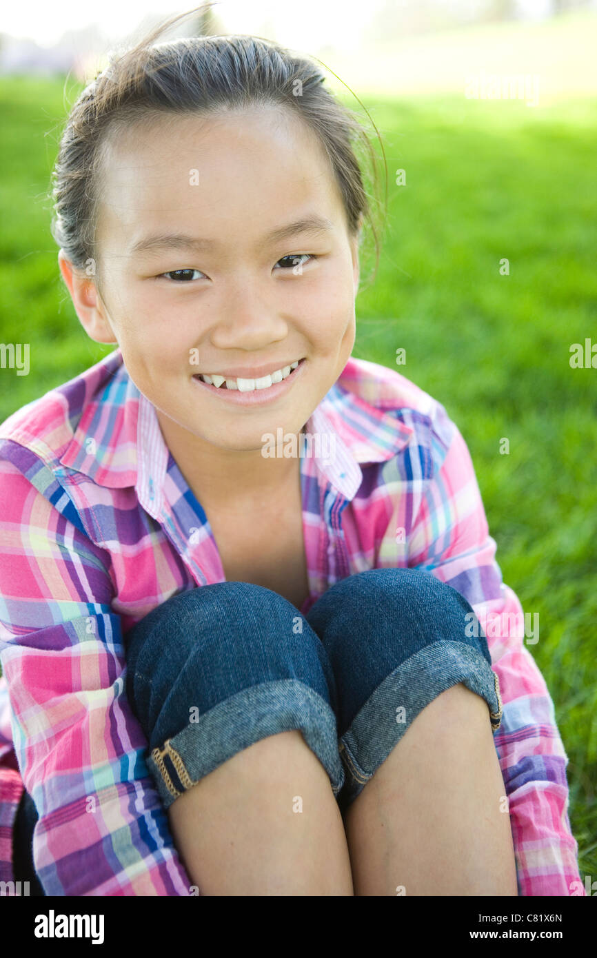 Smiling chinese girl sitting hi-res stock photography and images - Alamy