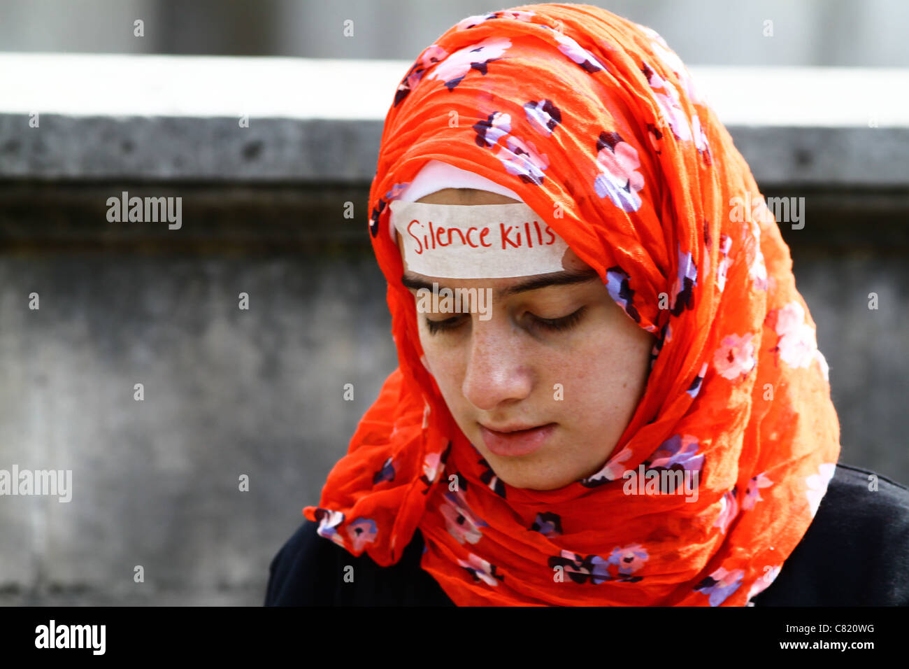 A girl taking part in a silent protest to highlight the political situation in Yemen. London, UK. Stock Photo