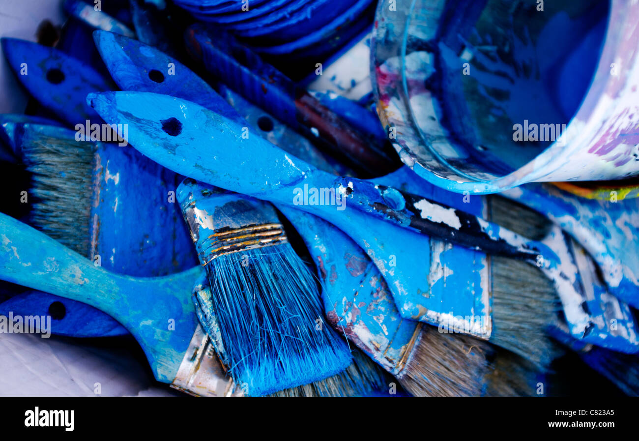 Blue paint brushes in bucket Stock Photo Alamy