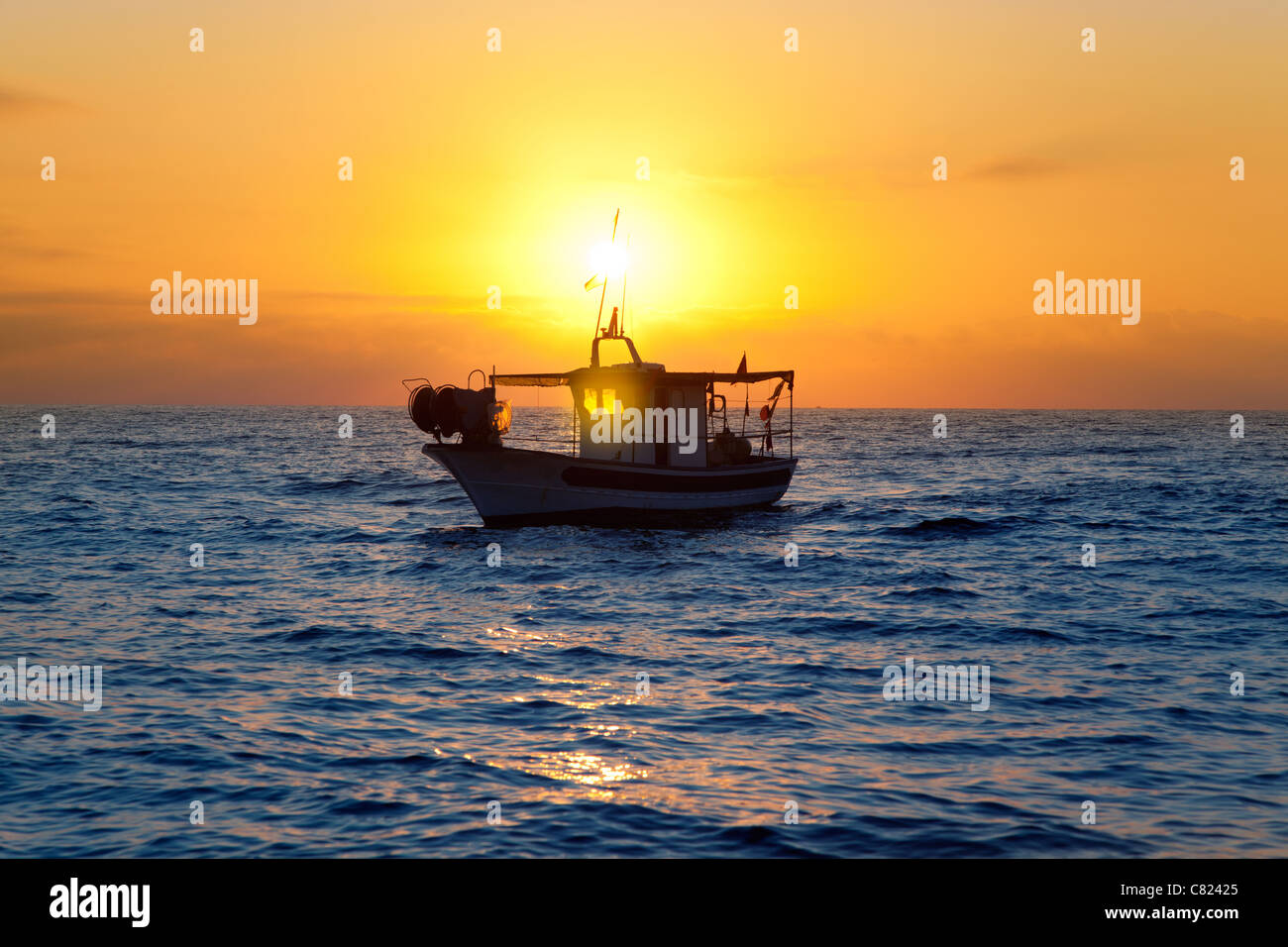 fishing boat in sunrise at Mediterranean sea traditional fishery Stock Photo