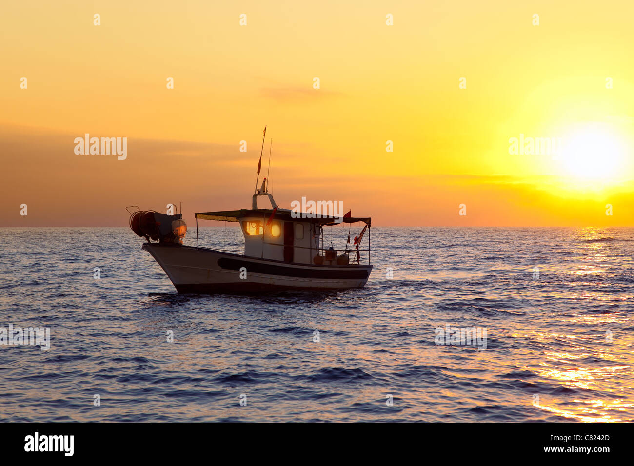 fishing boat in sunrise at Mediterranean sea traditional fishery Stock Photo