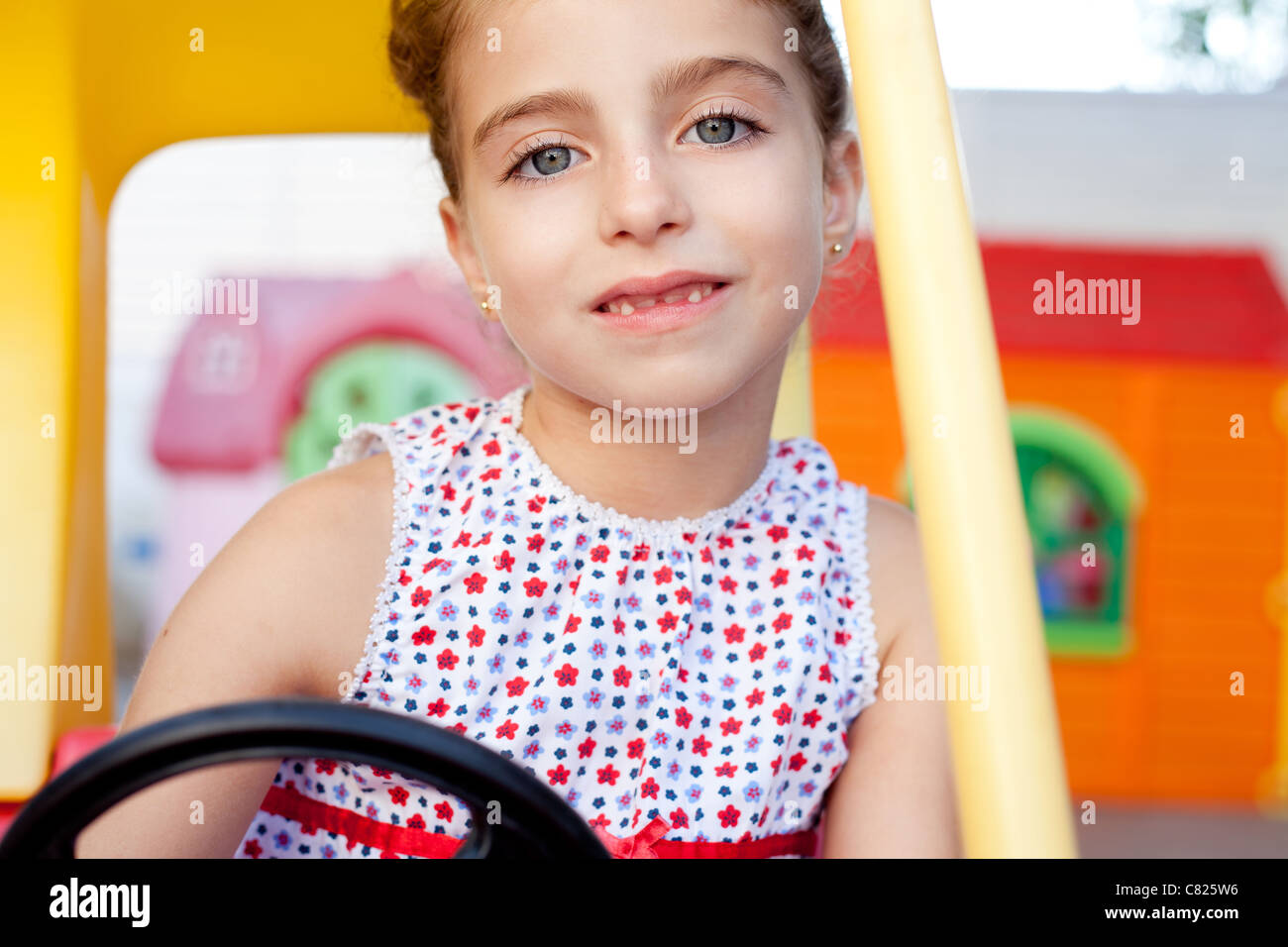 children girl driving a toy car in playground Stock Photo Alamy