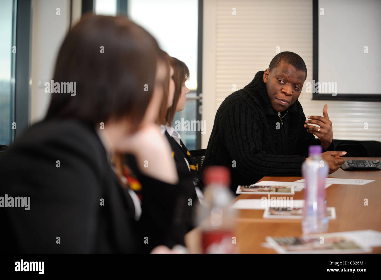 Children from Mitchell High School, Stoke-on-Trent at the City's YMCA for a talk about diversity with Chris Dryden (CH of NORSAC Stock Photo