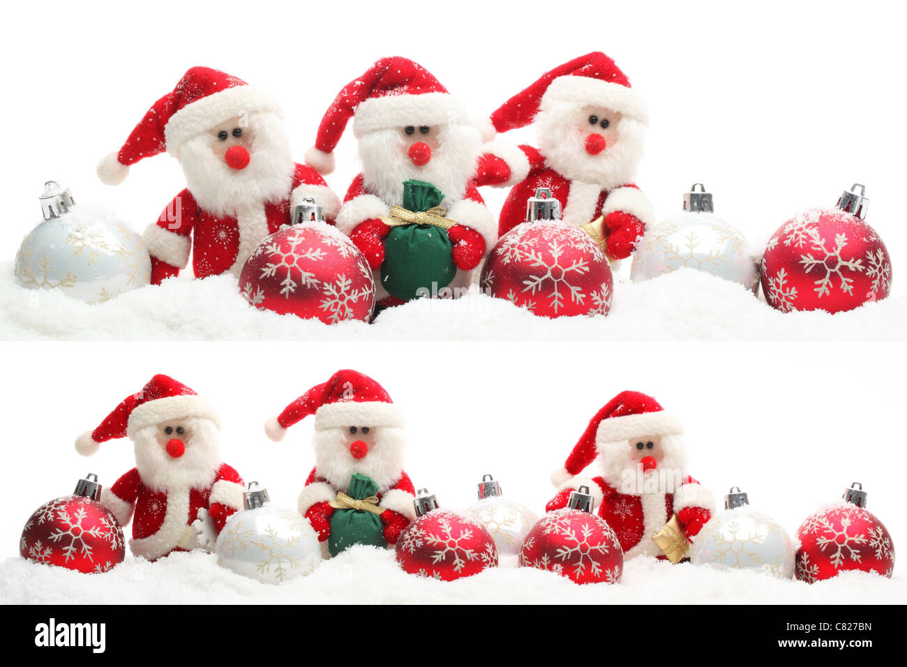 Santa Claus doll and Christmas balls on snow Stock Photo