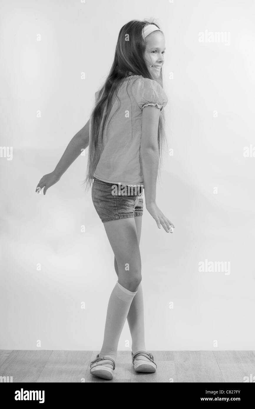 8 year old girls dancing in short shorts and T-shirt Stock Photo - Alamy