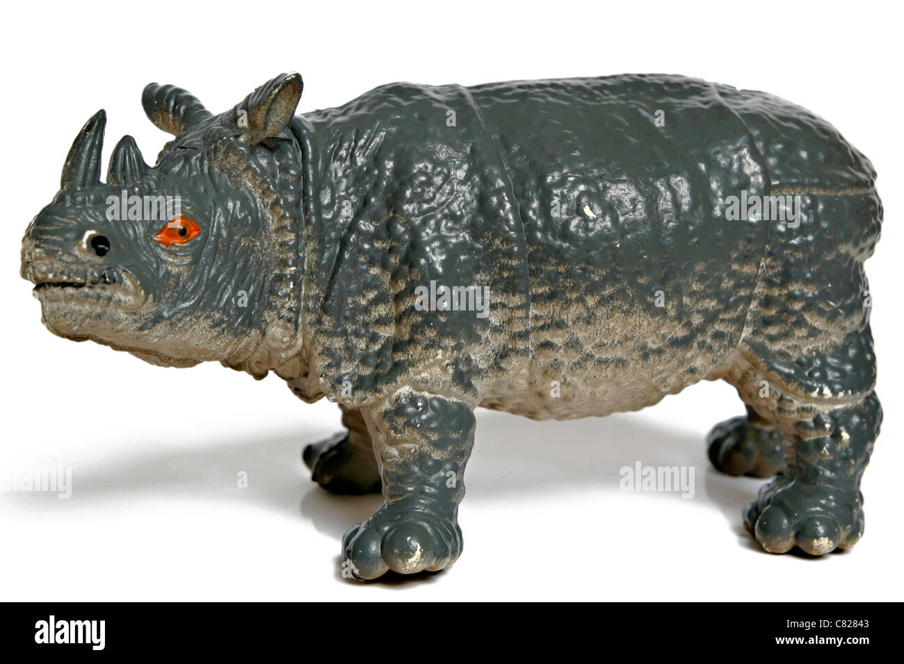 Plastic toy rhinoceros figurine isolated on white background Model