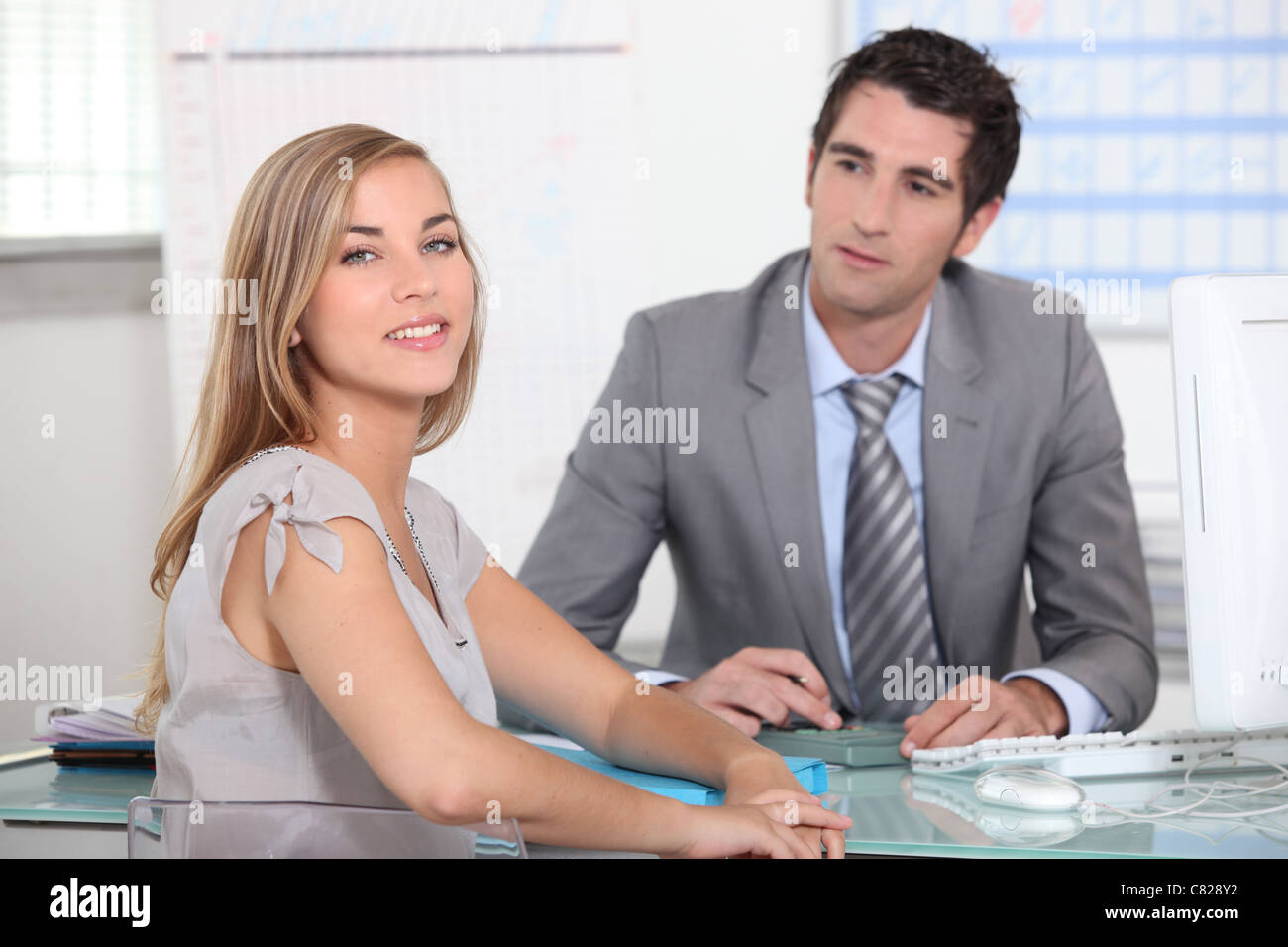 A businessman and a female customer in an office Stock Photo - Alamy