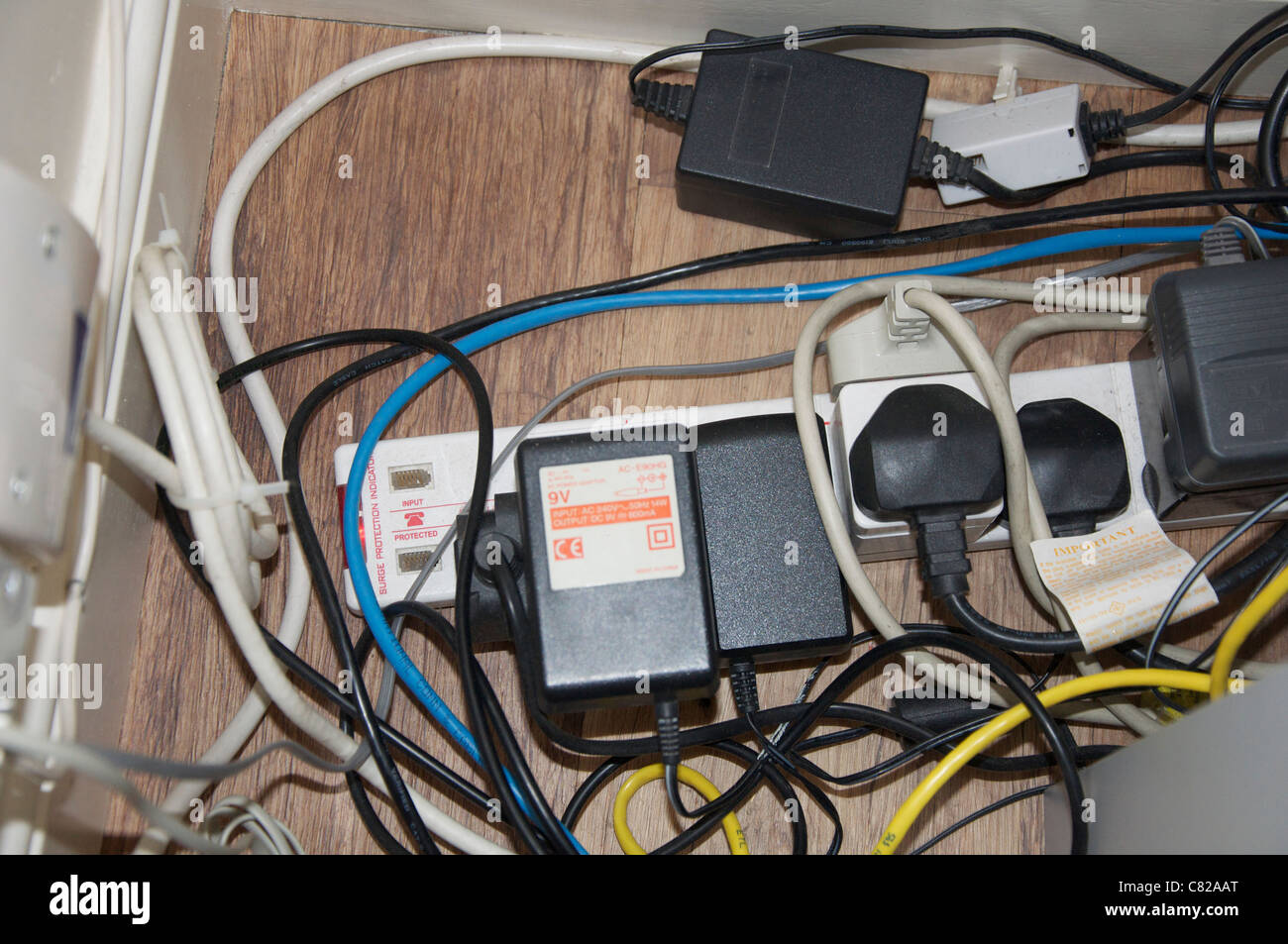 Health and safety issue with spaghetti electrics Stock Photo