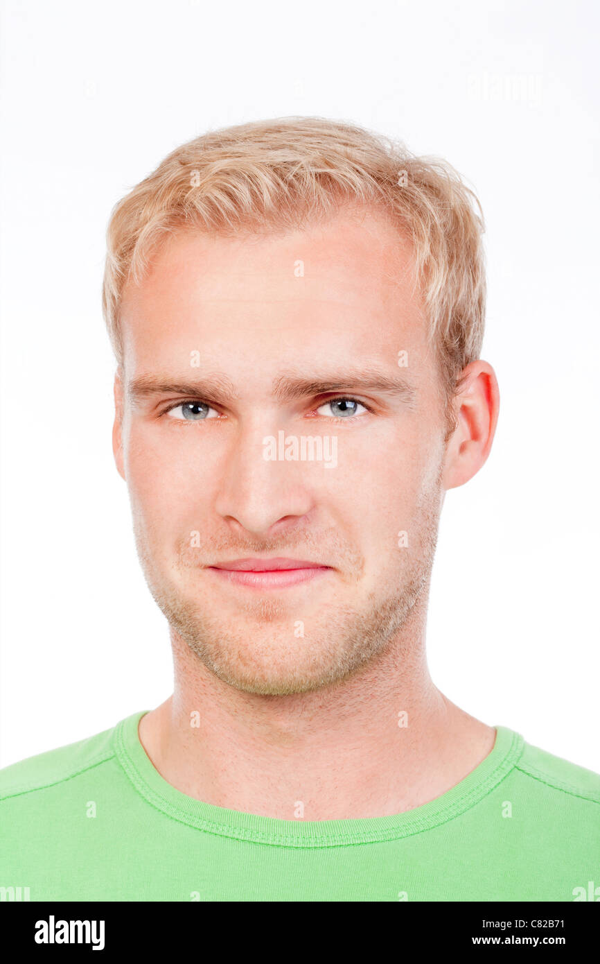 portrait of a young man with blond hair in green top smiling - isolated on white Stock Photo